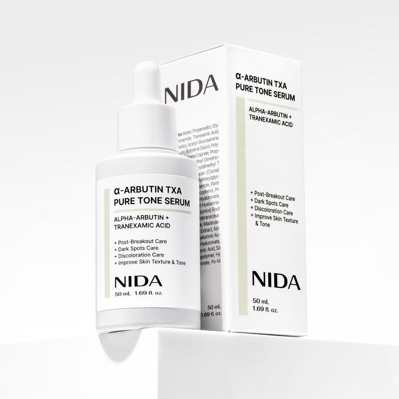 NIDA alpha-Arbutin TXA Pure Tone Serum Dark Spots Skin Tone GlowContains Batteries or Cells?: None 
 
 Dangerous Goods or Hazardous Materials: None 
 
 Aerosols: No 
 
 Flammable Liquid: No 
 
 Container Type: Bottle 
 
 Benefits: Hydrating, Anti-aging, Soothing, Smoothing, Brightening, Nourishing, Uneven Skin Tone 
 
 Region of Origin: Korea 
 
 Benefits: Revitalizing, Soothing, Pore Control, Nourishing, Dark Circles, Softening, Rejuvenate, Smoothing, Anti-Wrinkle, Brightening, Hydration, Plump, Repair, Oil Control, Moisturizing, Anti-Aging, Even Out Skin Tone & Texture 
 
 Shelf Life: 24 Months 
 
 Product Form: Serum 
 
 Age Group: Adults 
 
 Skin Type: All Skin Types 
 
 Pack Type: Single Item 
 
 Contains Alcohol or Aerosol: Contains Neither 
 
 Net Weight: 100G 
 
 Ingredients: Water, Propanediol, Glycerin, Niacinamide, Tranexamic Acid, 1,2-Hexanediol, Acetyl Glucosamine, Alpha-Arbutin, Butylene Glycol, Polyglyceryl-10 Caprylate/Caprate, Propoxytetramethyl Piperidinyl Dimethicone, Sodium Polyacryloyldimethyl Taurate, Theobroma Cocoa (cocoa) Extract, Trideceth-6, Ethylhexylglycerin, Disodium EDTA, Allantoin, Panthenol, Xanthan Gum, Tocopherol, Propylene Glycol, Sodium  Hyaluronate, Hydroxypropyltrimonium Hyaluronate, Licorice Root Glabra Licorice root Extract, Astragalus Membraneaceus root Extract, Glutathione, Madecassoside, Centella Asiatica Extract, Asiaticoside, Hydrolyzed Hyaluronic Acid, Sodium Acetylated  Hyaluronic Acid, Phenoxyethanol, Hyaluronic Acid, Sodium Hyaluronate Crosspolymer, Hydrolyzed Sodium Hyaluronate, Potassium Hyaluronate 
 
 Manufacturer: Proso IncML Clinic  for Wellness